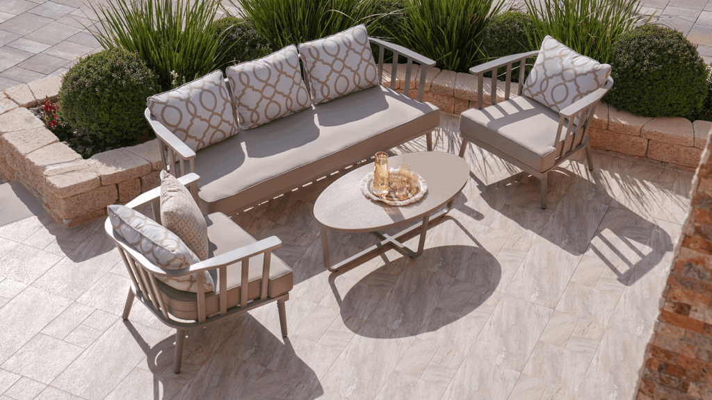 cushioned patio chairs and sofa placed around a small table