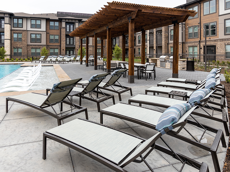 Modern Apartment Community Poolside Lounge Chairs Under Pergola