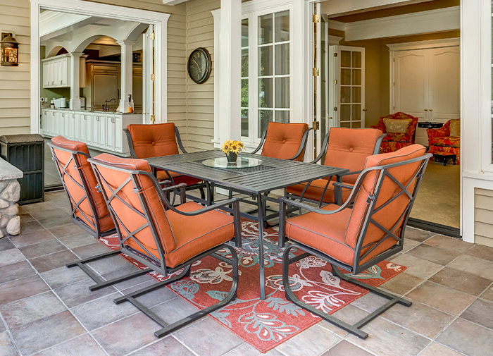 Outdoor Dining Set Black Metal Table Orange Cushions