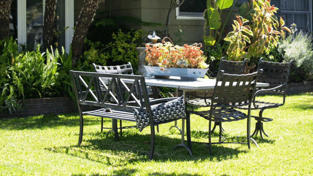 metal patio chairs and table in backyard